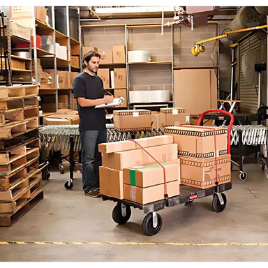 RubbermaidHeavy-DutyPlatformTruck_36Lx24W_2000lbs.Cap._PolyolefinWheels_2-man working in storage room with heavy duty platform truck